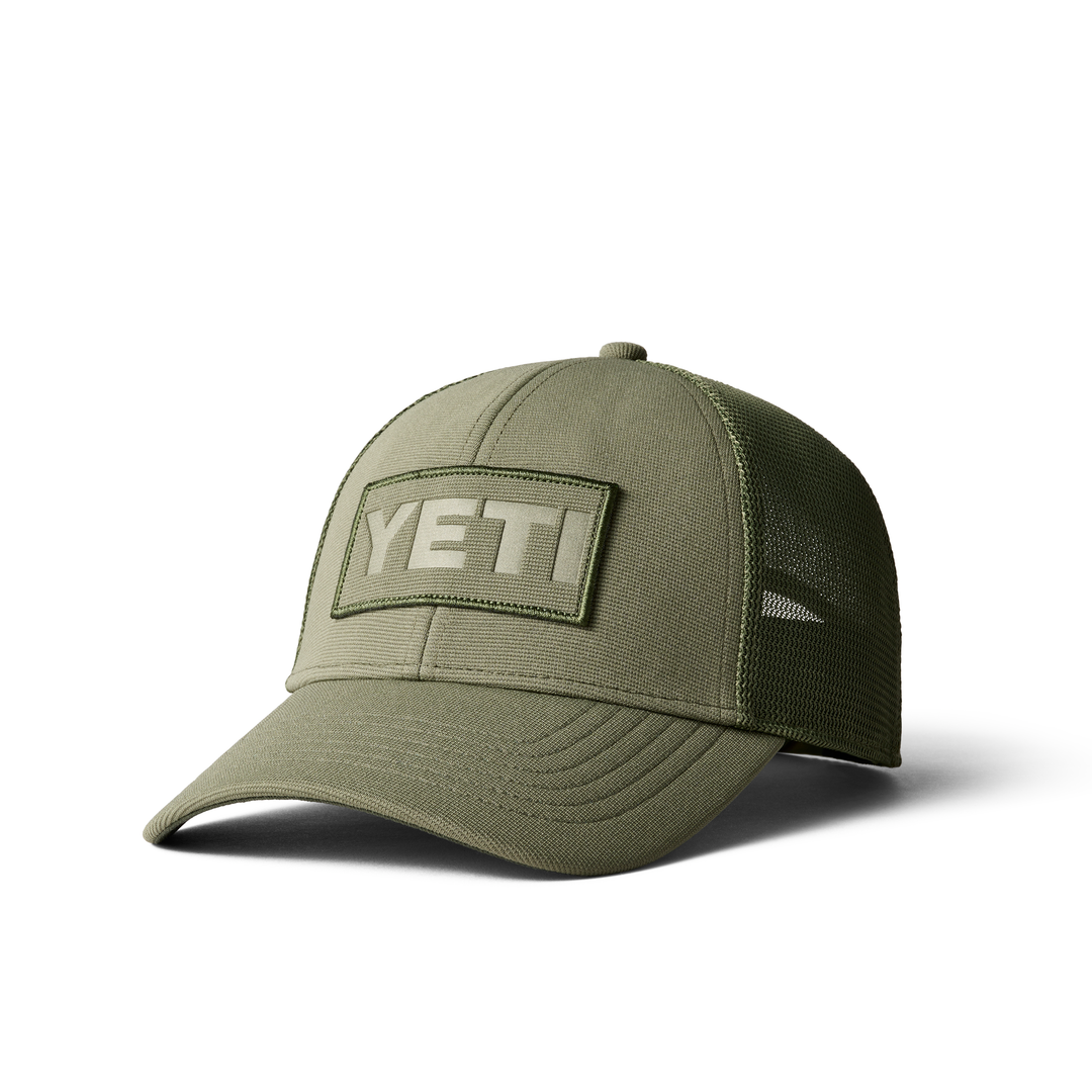 https://online.raxfin.ca/wp-content/uploads/2023/11/Social-Media-1080x1080-YETI_1H22_Hats_Logo_Badge_Patch_Trucker_Olive_3qtr_0118_Layers_F_2200x2200.png